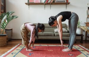 mother and daughter stretching exercise